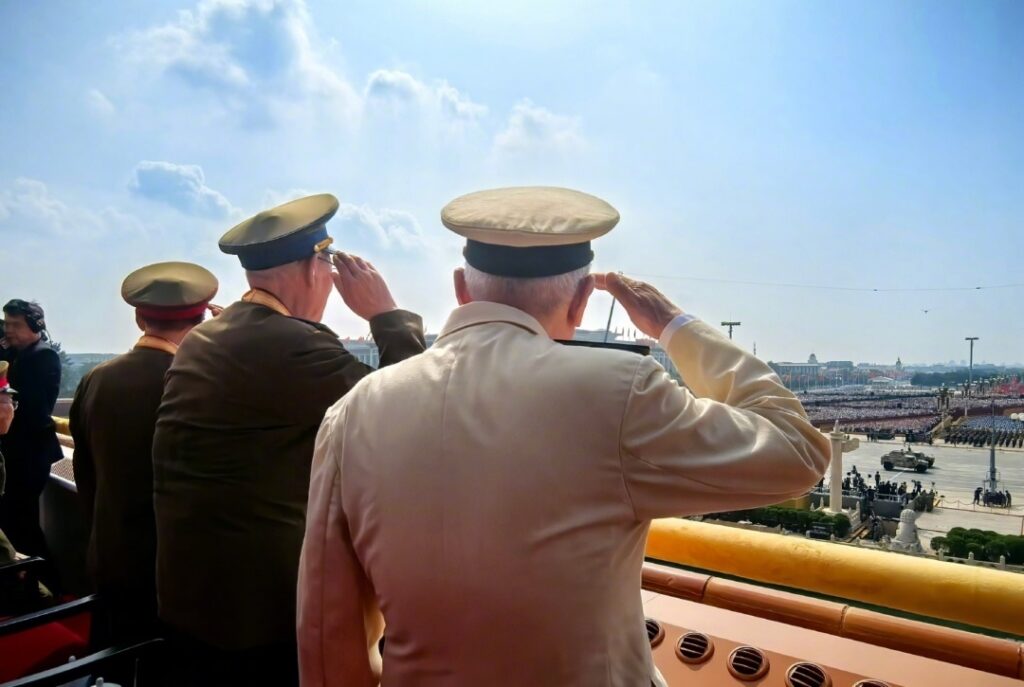 Несколько пожилых ветеранов с усилием поднялись и торжественно отдали честь